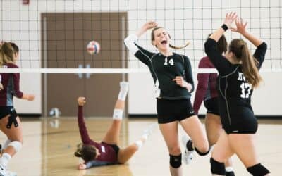 Women playing volleyball