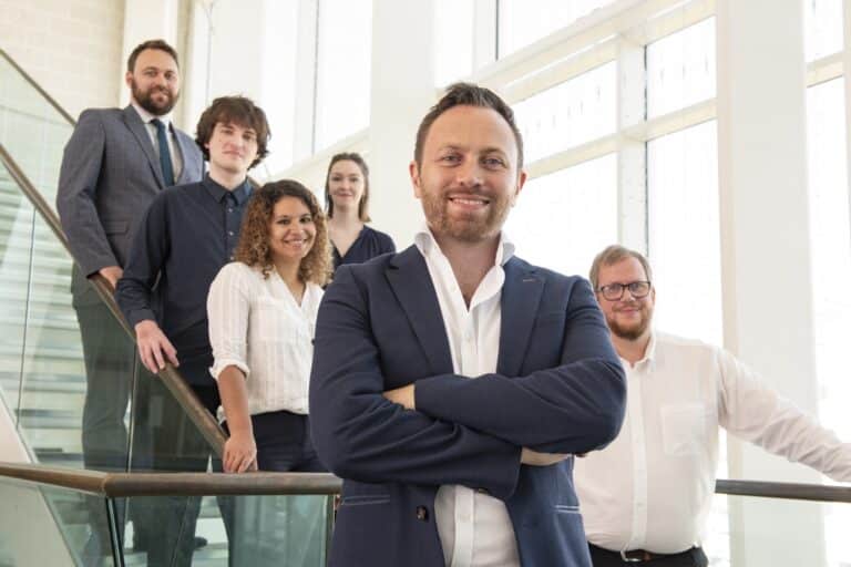 Aaron Crewe (front) and the Novi team