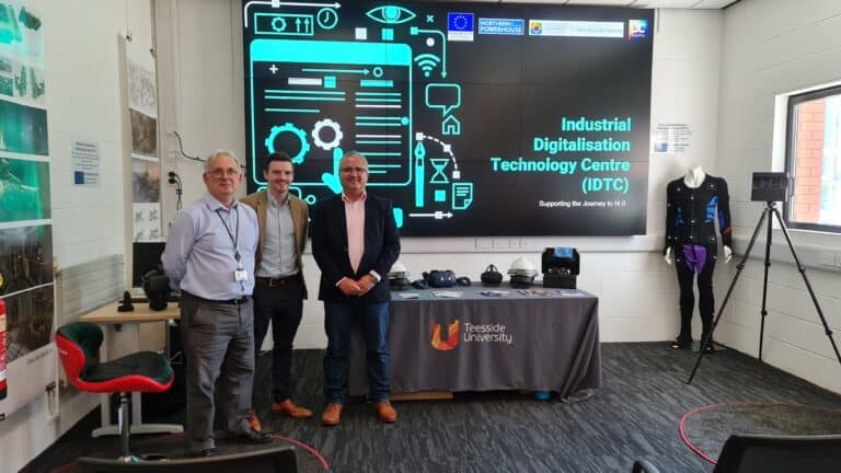 Dave Spencer, Michael Thompson (both IDTC) and ZEST I/'s Zeynel Badak in the IDTC lab