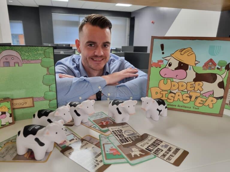 Craig Archdeacon with the board game version of Udder Disaster