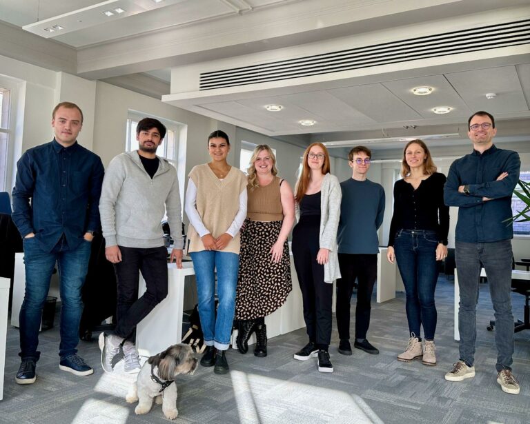The One Day team, complete with office dog