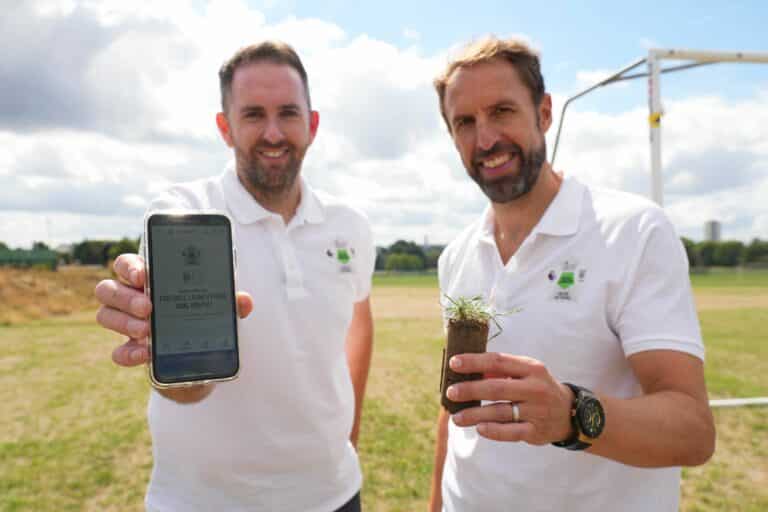 Wembley's grounds manager Karl Standley and Gareth Southgate check out the app