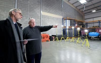 Ian Pearce, right, shows Knowsley MP George Howarth round the new facility