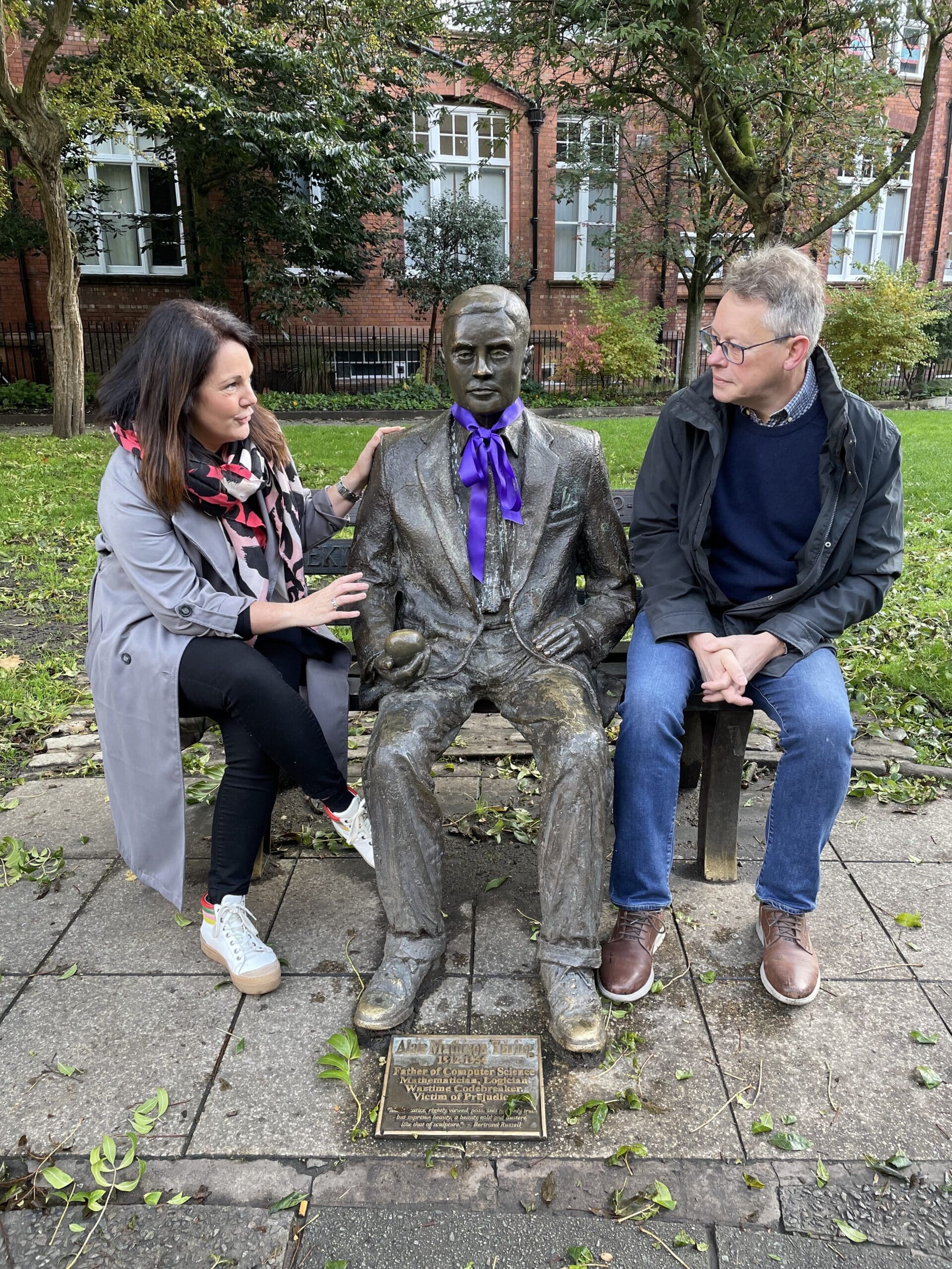 Karen Milligan and Dermot Turing with the Alan Turing statue in Manchester's Sackville Gardens
