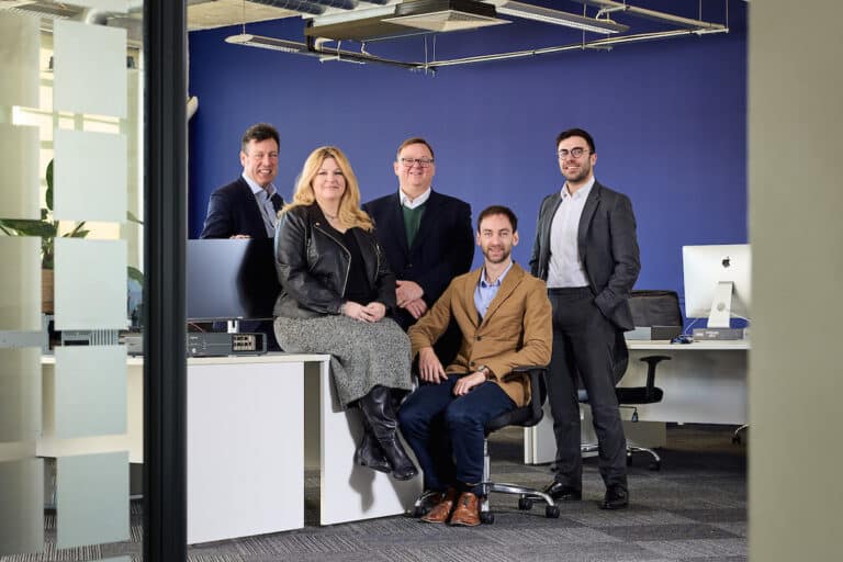 The Sitehop team, founders Chambers and Harper front row