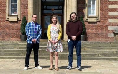 Leeds Beckett's Mike Hall with Frame's Hannah Bratley and Liam Fulton