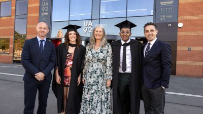 Nicky Butt and Gary Neville with graduates of UA92